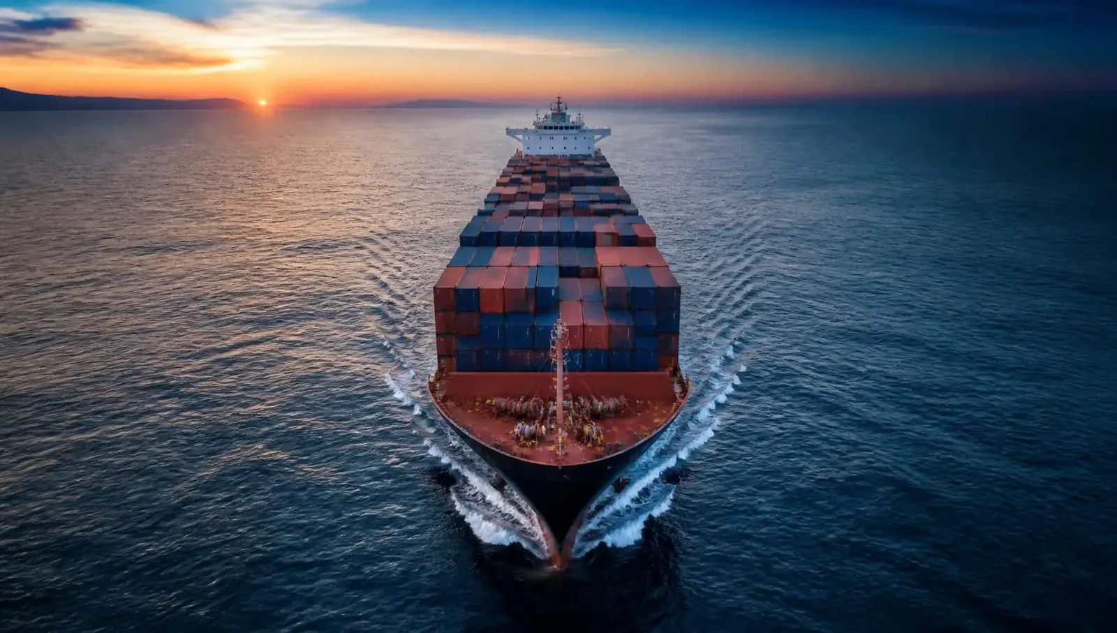Container ship carrying cargo across open sea